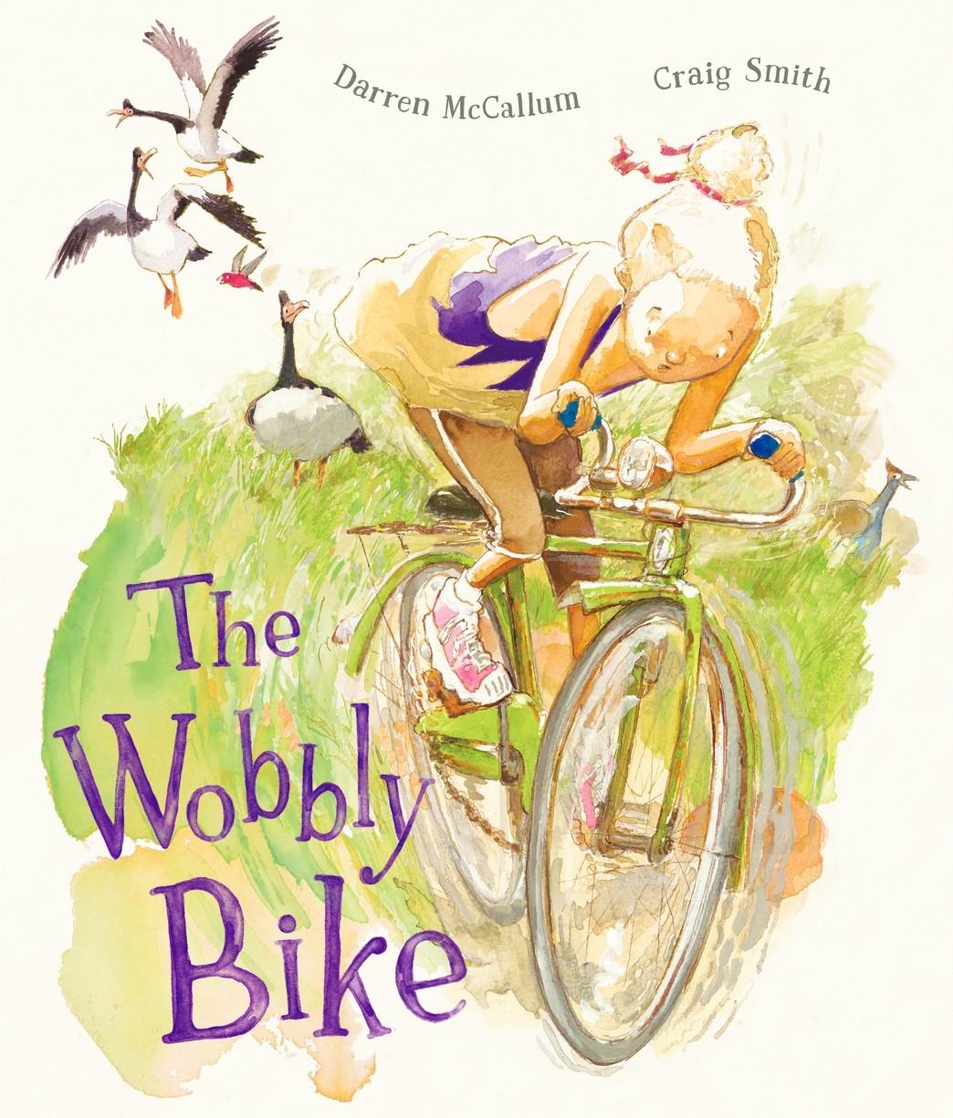 This is the cover for ‘The Wobbly Bike’ Written by Darren McCallum and illustrated by Craig Smith. The cover shows a girl looking concerned as she rides a bike and birds squawk behind her.